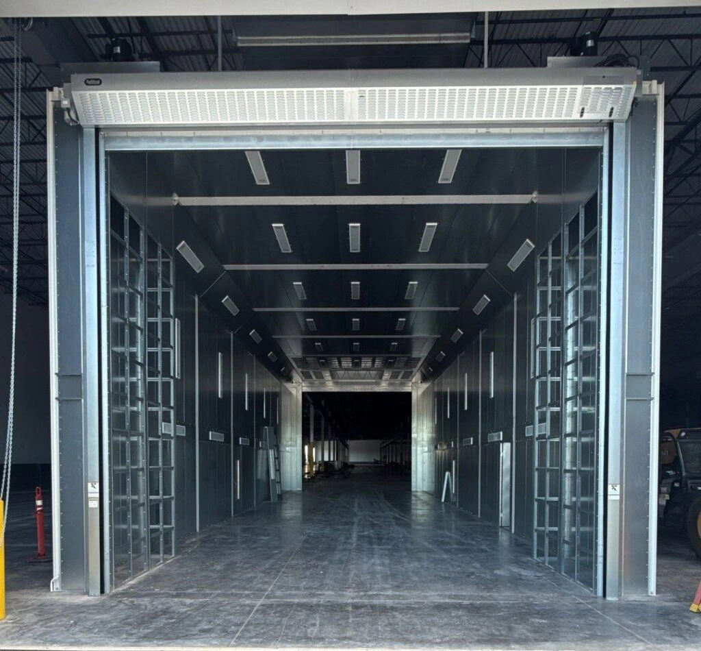 Large equipment paint booth interior used as a featured image for paint booth lighting upgrade planning