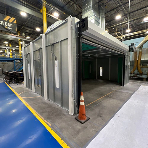 Enclosed industrial paint booth used as a featured image for OSHA-related paint booth planning