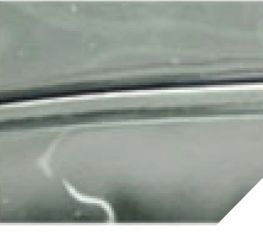 Close-up of automotive surface with paint defect or damage