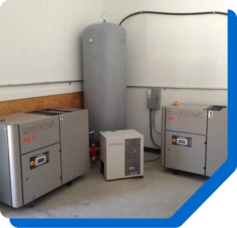 Efficient air compressor setup with storage tank and control panels.