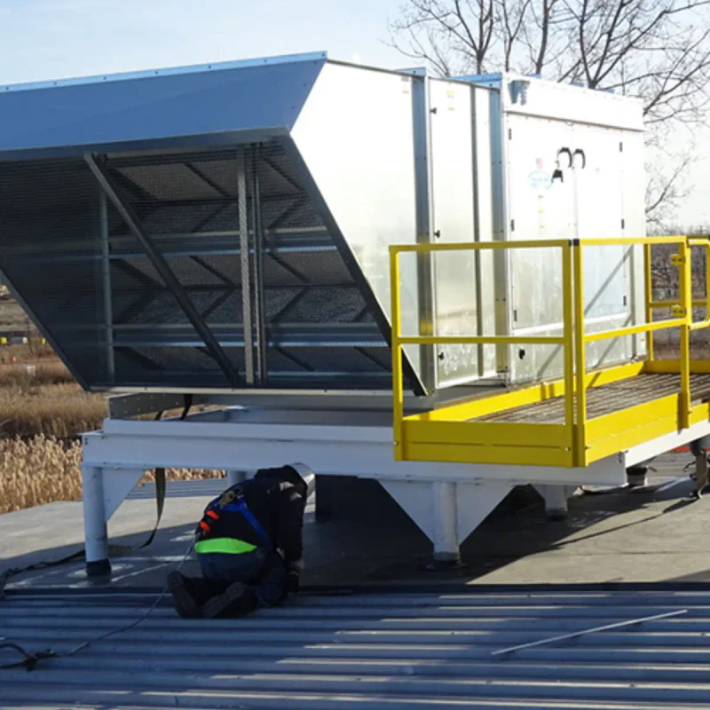 Booth-mounted air makeup unit connected to a paint booth.