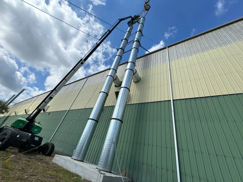 Industrial exhaust stack installation for paint booth permitting and ventilation planning