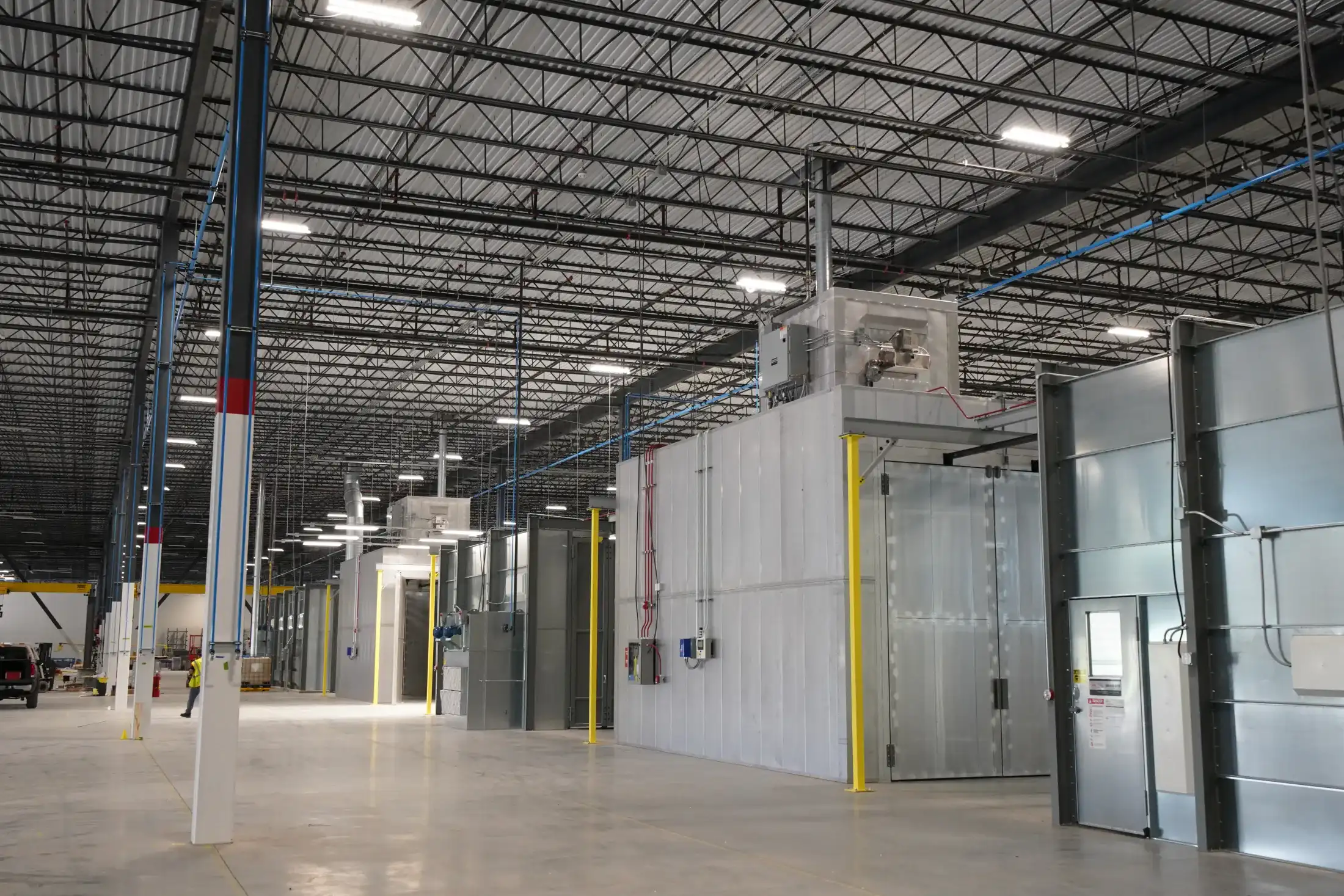 Powder coating booth line in an industrial facility