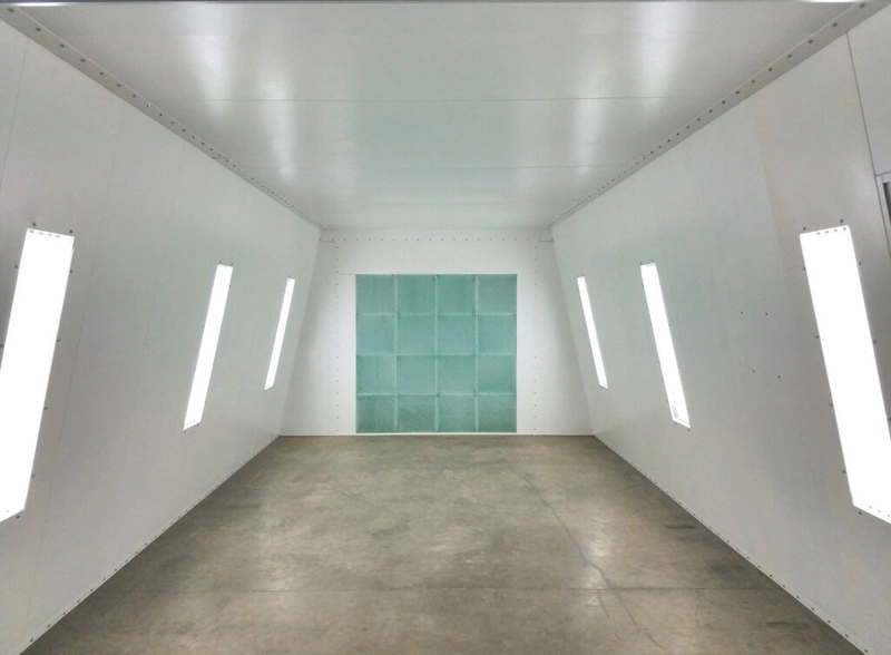 Interior of a modern paint booth with bright lighting