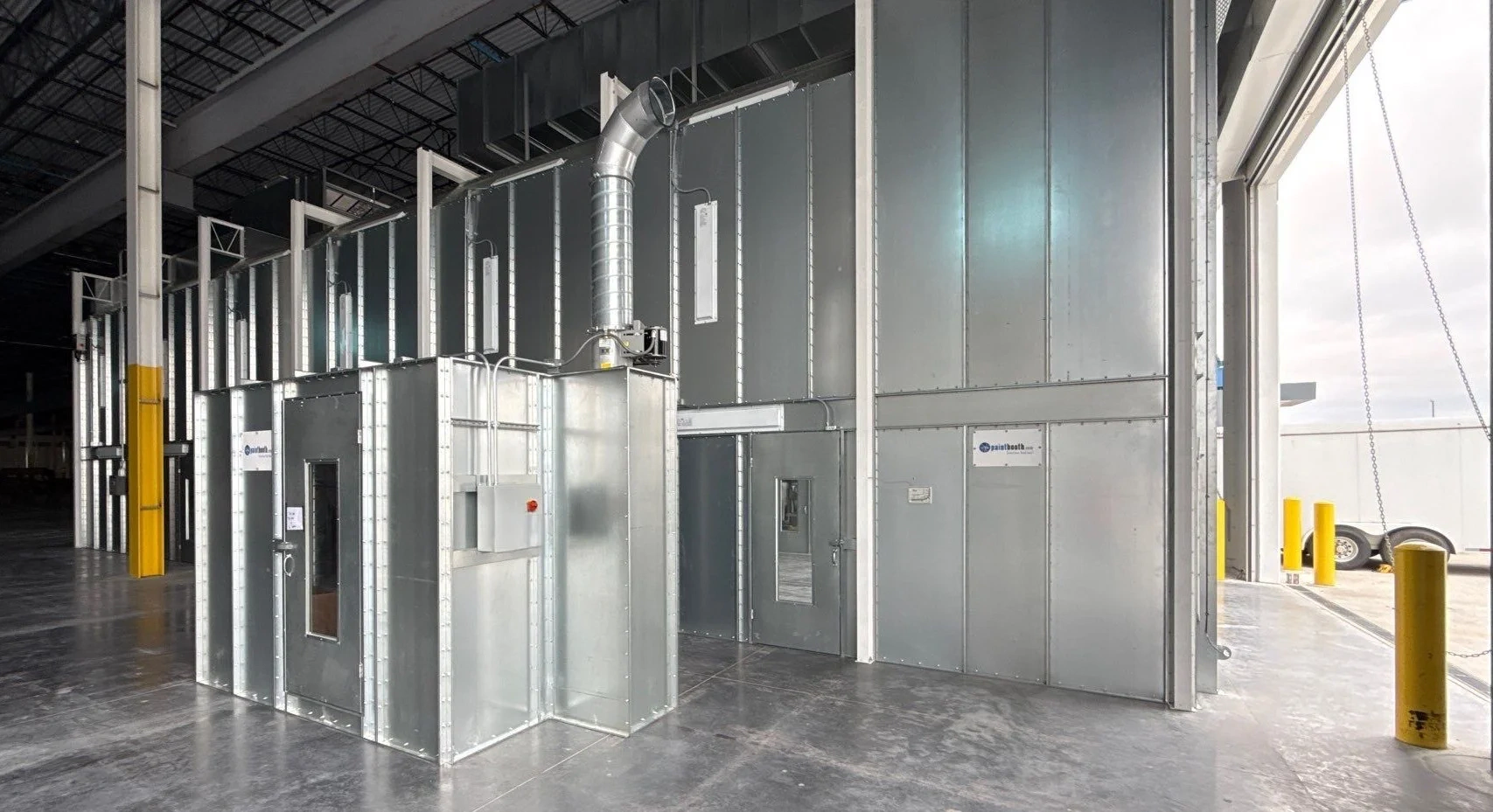 Paint booth with an adjacent paint mix room