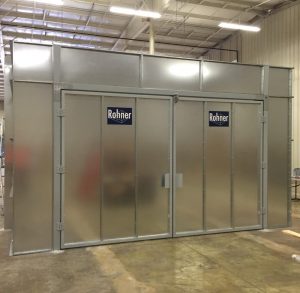 Industrial Rohner metal paint booth with double doors in warehouse