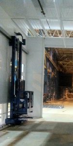 Industrial vertical lift inside a large factory or warehouse