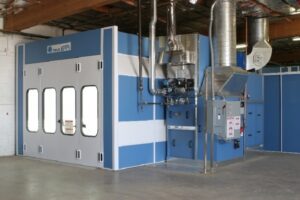 Industrial paint booth setup with ventilation system